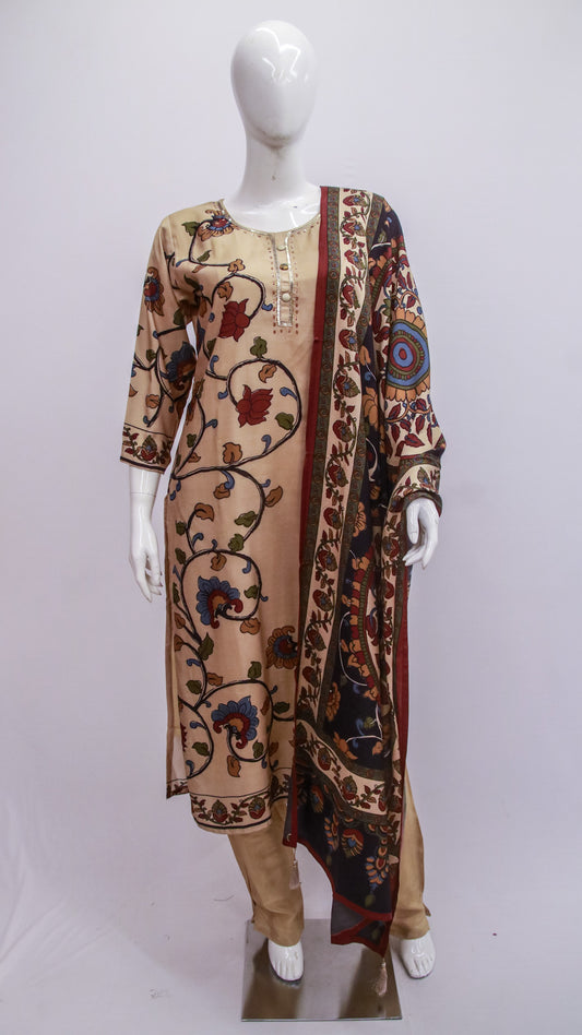 Mannequin wearing a patterned dress with a long scarf on a white background