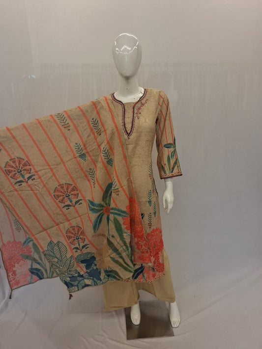 Mannequin wearing a beige kurta with floral patterns and an orange dupatta on a white background