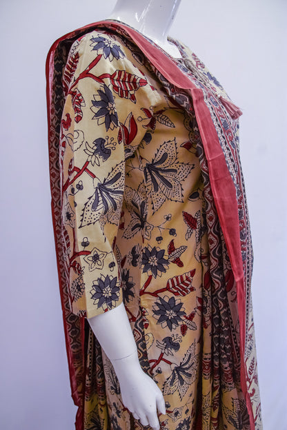 Mannequin wearing a patterned dress with a red border on a white background