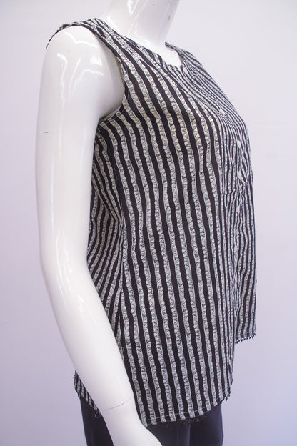 Mannequin wearing a black and white striped sleeveless top on a white background