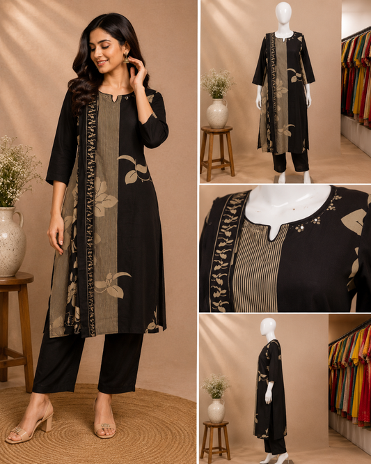 A woman modeling a black kurta set with beige and gold floral prints and striped paneling, shown alongside mannequin views and a close-up detail panel of the neckline. The setting is a warm beige studio with furniture and clothing racks in the background.