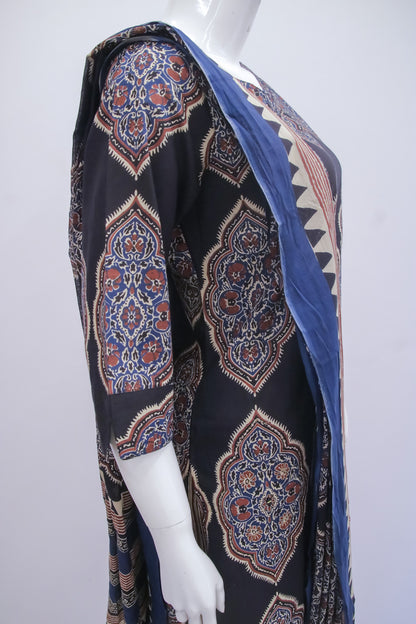 Mannequin wearing a patterned scarf with a black background