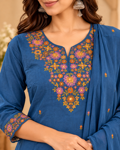 Blue women's kurta pant set with multicolour floral embroidery, matching pants and blue dupatta.
