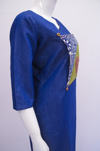 Blue dress with colorful patch on a white background
