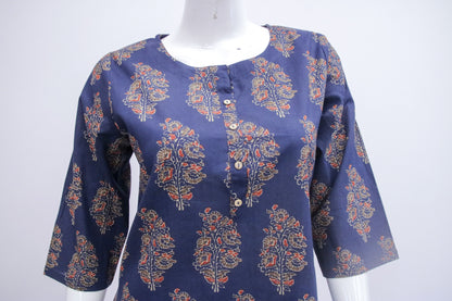 Navy blue blouse with floral pattern on a mannequin against a white background