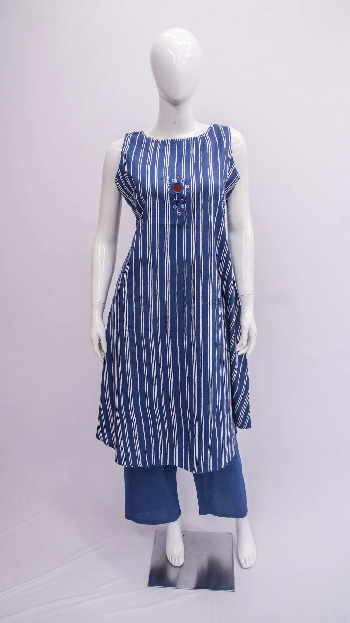 Mannequin wearing a blue and white striped dress with matching pants on a white background