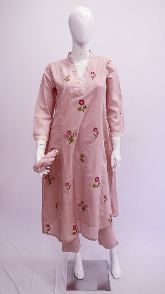 Pink embroidered dress on a mannequin against a white background