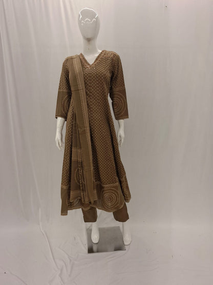 Brown dress with matching scarf on a mannequin against a white background