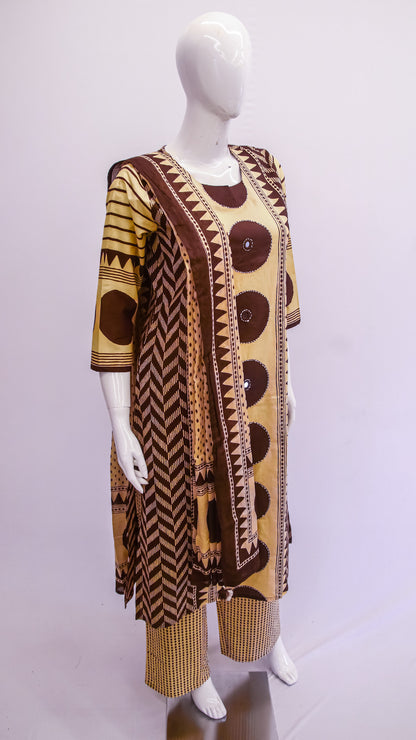 Mannequin wearing a patterned dress with a plain background