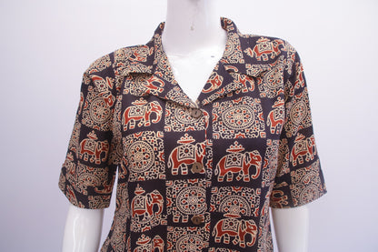 Mannequin wearing a patterned shirt with elephants on a white background