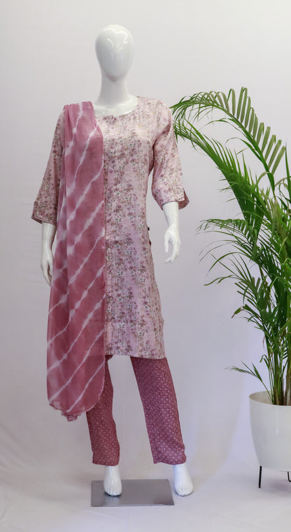 A mannequin displaying a pink and white capsule rayon dupatta set with floral prints, consisting of a kurta, pant, and dupatta.