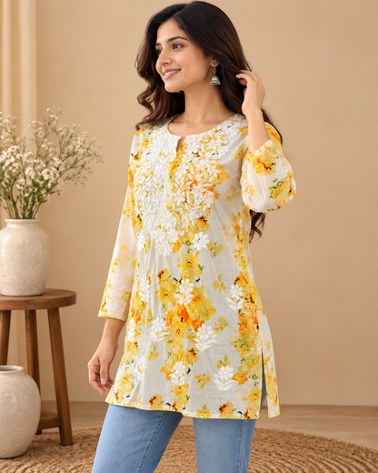 Yellow floral printed cotton kurti with white floral embroidery and three-quarter sleeves