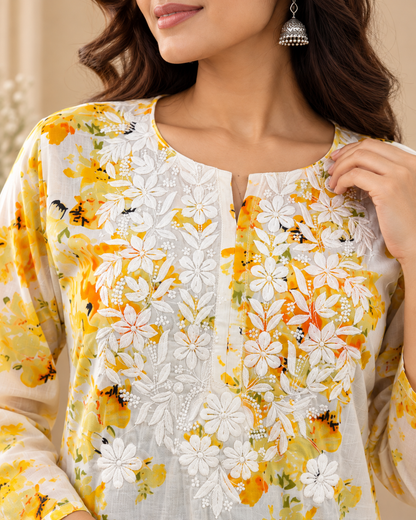Yellow floral printed cotton kurti with white floral embroidery and three-quarter sleeves