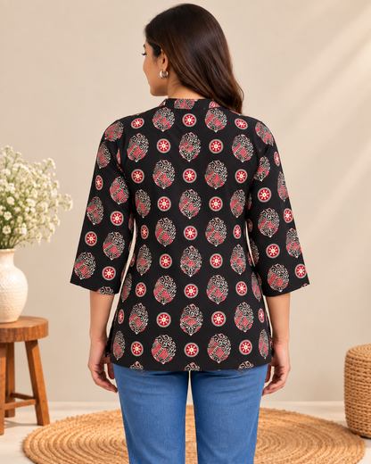 Black short top with red and white traditional printed motifs and 3/4 sleeves