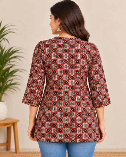 Maroon geometric printed cotton short kurti with multicolour ethnic motifs and tassel neckline