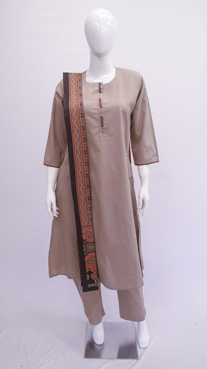 Mannequin wearing a beige kurta with a long skirt and border on a white background