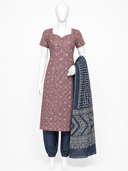 Mannequin wearing a red patterned kurta with navy pants and a matching scarf on a white background