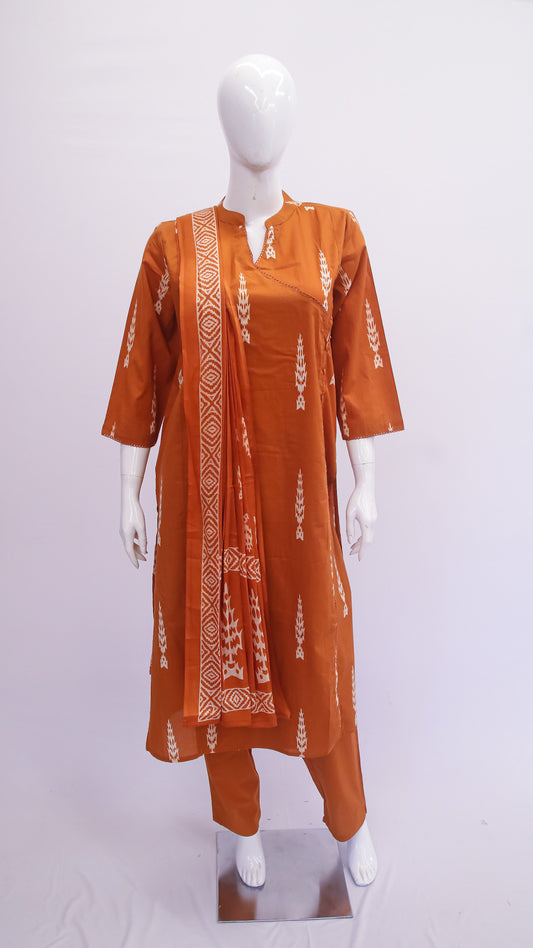 Orange kurta with white patterns on a mannequin against a white background