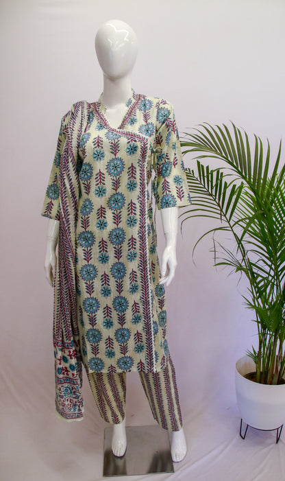 Cotton Angrakha Dupatta Set displayed on a mannequin with a floral print design in gray, blue, and green colors, accompanied by a potted plant in the background.