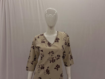 Mannequin wearing a beige floral-patterned shirt against a plain background