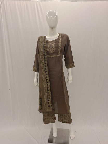Brown traditional outfit with embroidered details on a mannequin against a white background