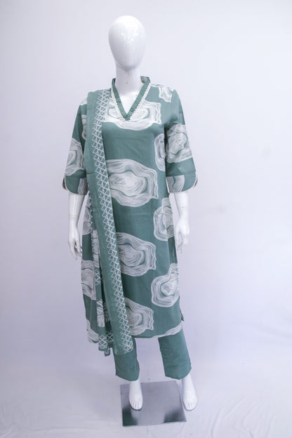 Green and white patterned outfit on a mannequin against a white background