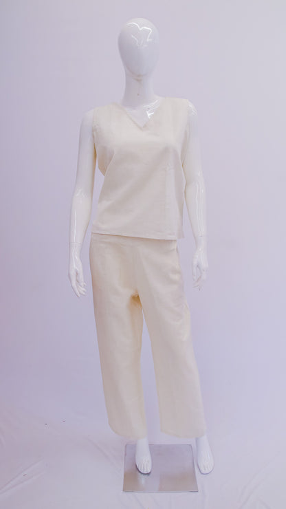 Mannequin wearing a cream-colored outfit on a white background