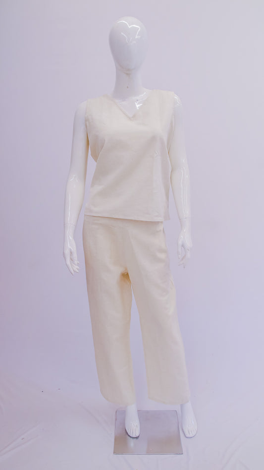 Mannequin wearing a cream-colored outfit on a white background