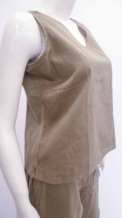 Beige sleeveless top on a mannequin against a white background