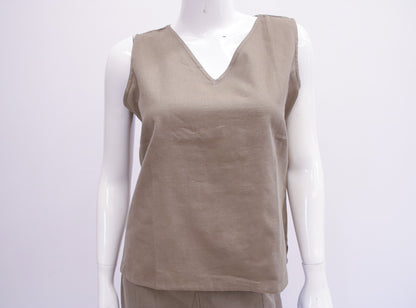 Beige sleeveless top on a mannequin against a white background