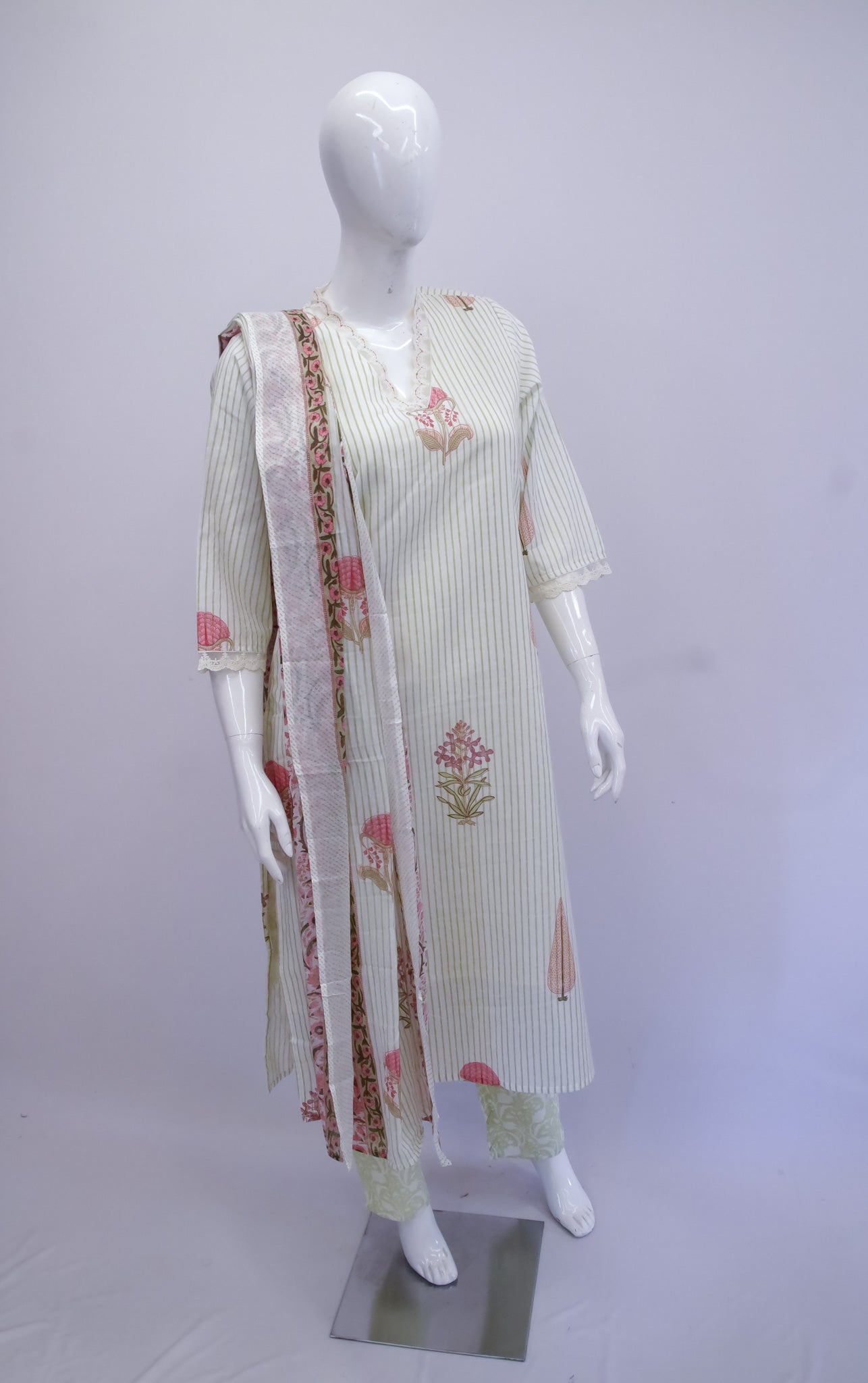 Mannequin wearing a white kurta with floral patterns and a matching dupatta on a white background