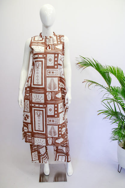 Mannequin wearing a brown and white patterned dress with a plant in the background