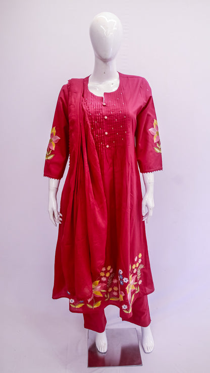 Red embroidered outfit on a mannequin against a white background