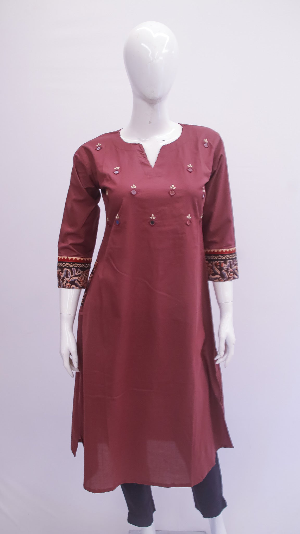 Maroon kurta with intricate patterns on a mannequin against a white background