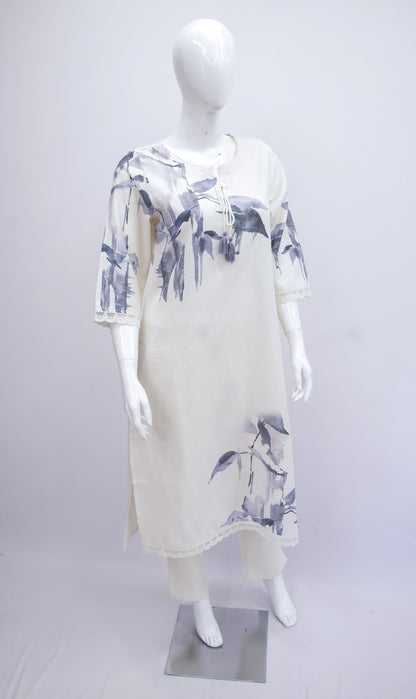 White dress with blue floral pattern on a mannequin against a white background