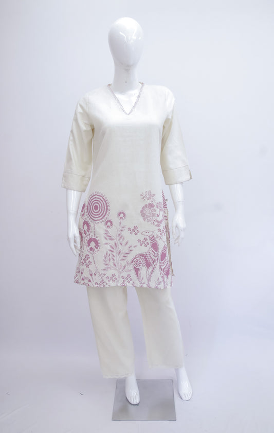 Mannequin wearing a white outfit with pink floral patterns on a white background