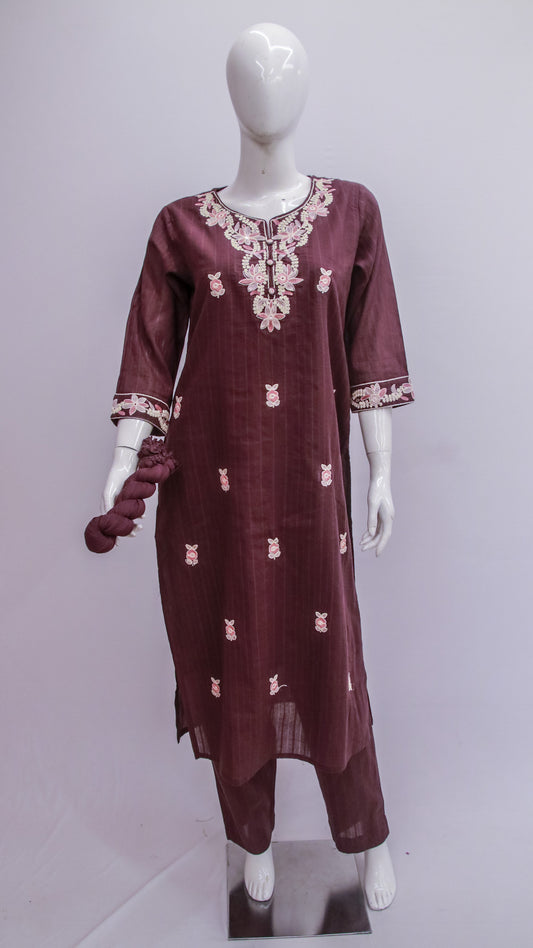Maroon embroidered dress on a mannequin against a gray background