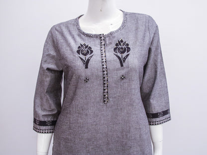 Gray kurta with black floral embroidery on a mannequin against a white background