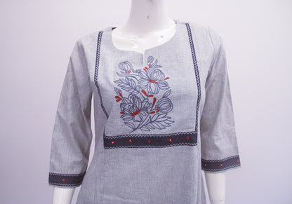 Gray kurta with floral embroidery on a mannequin against a white background