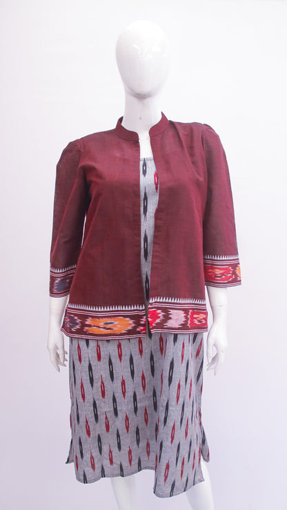 Maroon jacket with patterned skirt on a mannequin against a white background