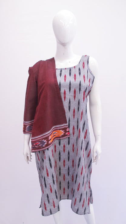 Mannequin wearing a gray patterned dress with a maroon shawl on a white background