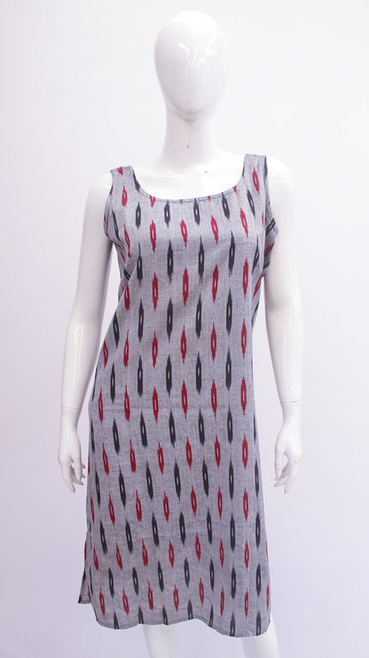 Mannequin wearing a sleeveless dress with a pattern on a white background