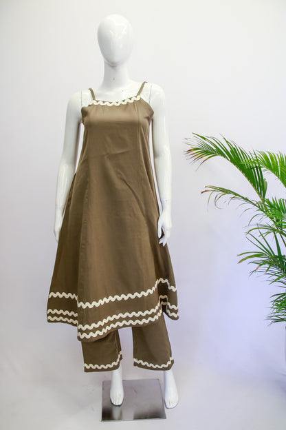 Brown dress with white trim on a mannequin against a white background