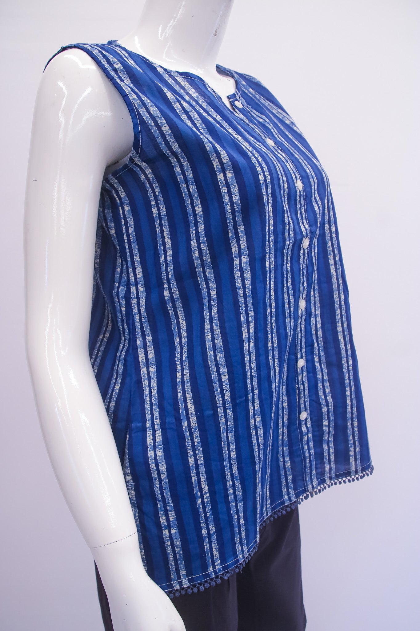 Blue and white striped top on a mannequin against a white background