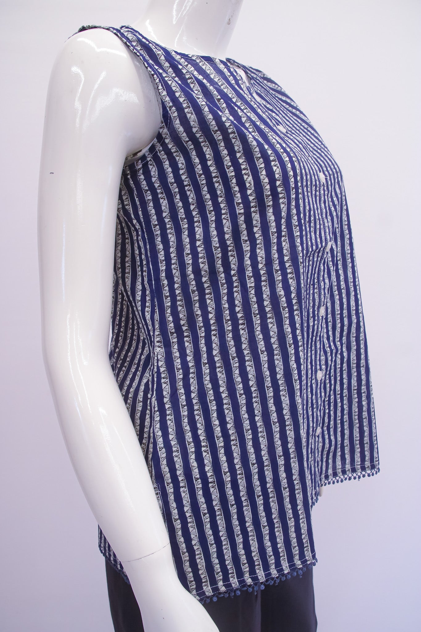 Mannequin wearing a blue and white striped top on a white background