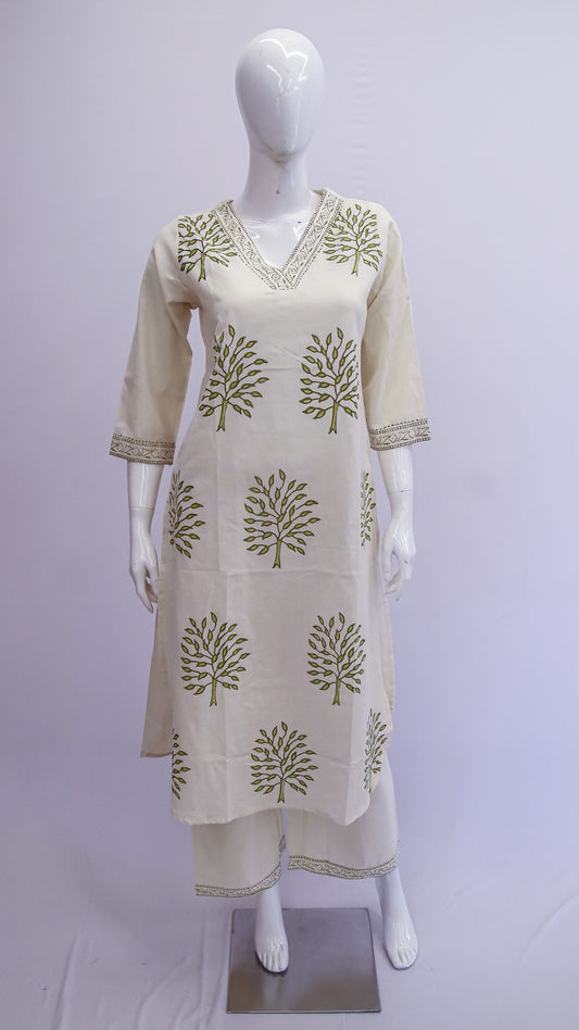 White kurta with green leaf patterns on a mannequin against a white background