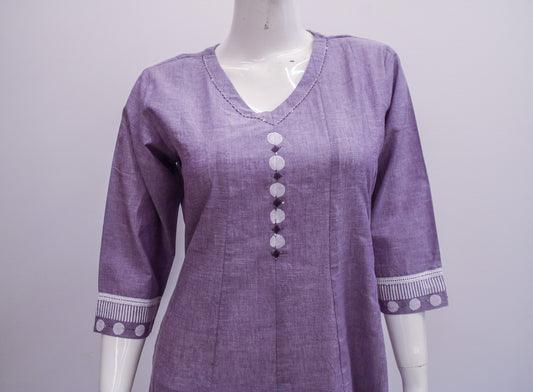 Purple shirt with decorative buttons on a mannequin against a light gray background