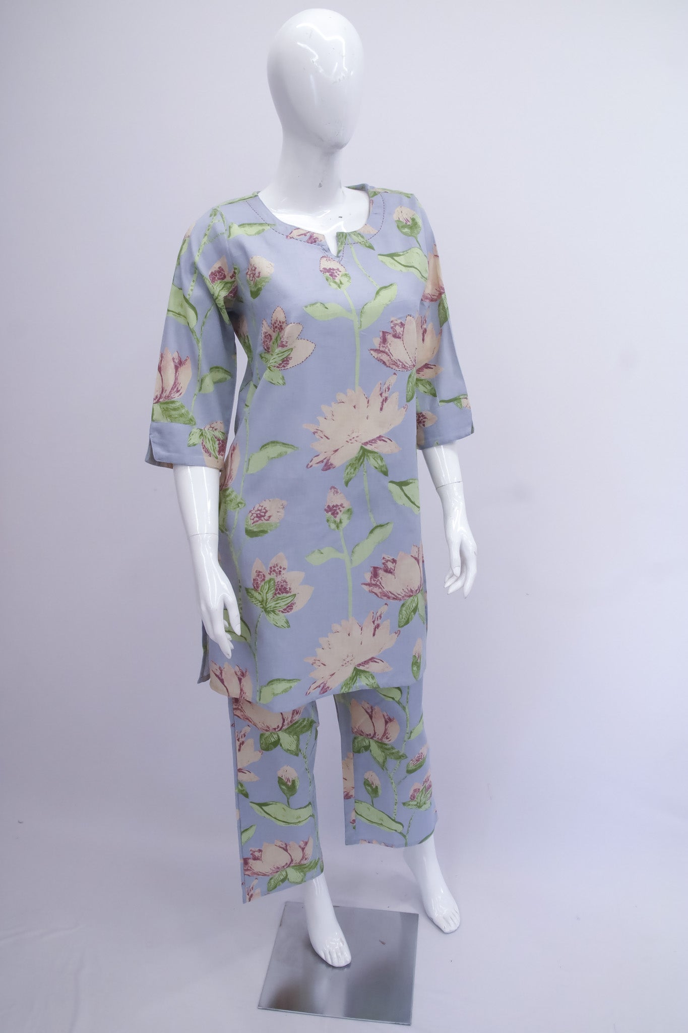 Floral pajama set on a mannequin against a white background
