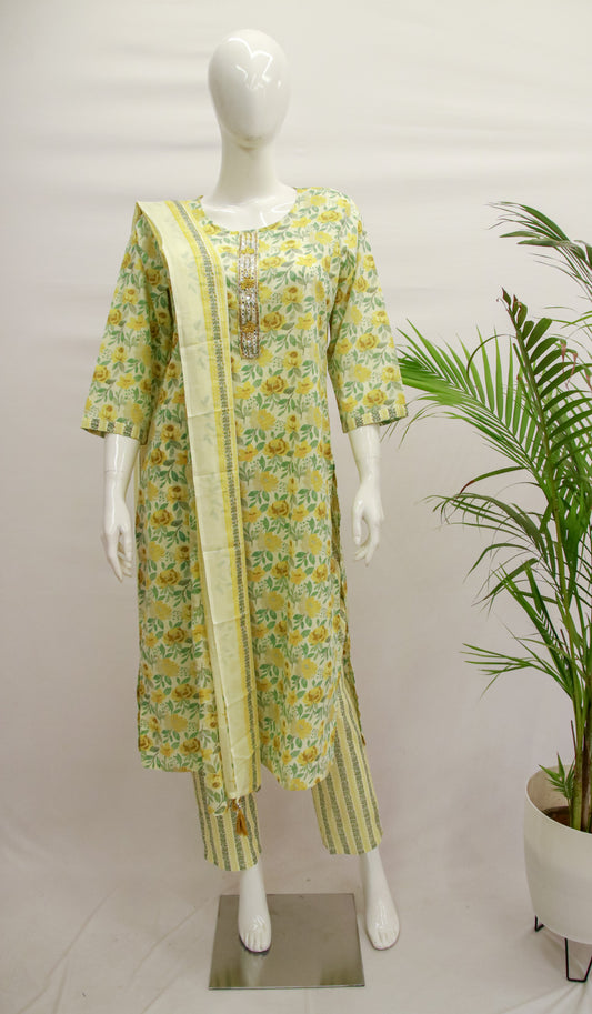 A traditional Light Yellow Cotton Dupatta Set displayed on a mannequin, featuring a kurta, pant, and dupatta with a floral print pattern.