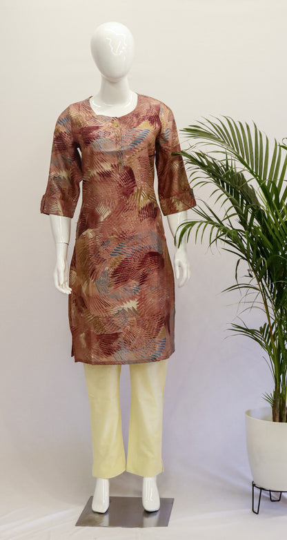A mannequin displaying a lilac and brown muslin kurta with a round neckline and 3/4 sleeves, paired with yellow trousers.